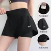 Nuevos shorts deportivos transfronterizos, diseño falso de dos piezas, secado rápido, pantalones de yoga anti-exposición con bolsillos, shorts de fitness para mujer