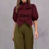 2026 Europeu e Americano transfronteiriço comércio exterior cor sólida design manga de lanterna com laço blusa gola alta casual curta para mulheres