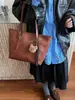 Venta al por mayor Envío directo Bolso de hombro individual para mujer de gran capacidad 2026 Otoño Nuevo Bolso tote de moda Bolso de trabajo Versátil a la moda