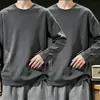 Camiseta casual versátil de manga larga para hombre para otoño, cuello redondo, color liso moderno, cómoda, transpirable y de corte holgado.