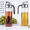 Fabricante de aceitera de vidrio personalizada de cocina con apertura y cierre automático, de gran capacidad, para salsa de soja, vinagre y condimentos, botella de acero inoxidable a prueba de fugas.