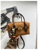 Bolso de mano Boston de gamuza vintage transfronterizo para mujer, nuevo bolso nicho de alta moda tipo almohada, bolso de hombro y bandolera