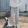 Pantalones de hombre primavera y otoño 2022 con cordón atados al tobillo pantalones deportivos holgados estudiante rectos de pierna ancha casuales pantalones de chándal hombre