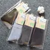 Calcetines para hombre de tubo medio empaque individual otoño e invierno color liso grosor medio casual de negocios calcetines de algodón fabricantes venta al por mayor calcetines para hombre