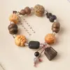 Pulsera tallada de múltiples cuentas de círculo único Calabaza de madera que cumple deseos Estilo chino nuevo Estilo antiguo Pulsera Cuentas budistas Rosario Juguete