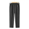 Calças retas de alta qualidade para mães, novo estilo outonal, adequadas para mulheres acima de 50 anos, estilo comercial, calças versáteis de cor sólida slim fit para mulheres de meia-idade e idosas