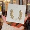 Aretes de botón de pétalos de diamantes completos de aguja de plata 925 Pendientes de moda de lujo ligero para mujer Pendientes versátiles Pendientes de alta gama al por mayor