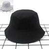 Venta al por mayor de elegante sombrero de pescador para mujer, estilo coreano, sencillo, a cuadros, de doble cara, para hombre, parasol de verano para exteriores, sombrero para pareja, tendencia de moda.