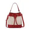 Bolsa Feminina Fashion Combinando Cores Bolsa Saco Vazado Estilo Coreano Bolsa Transversal Feminina Bolsa de Palha de Ombro para Meninas Atacado de Comércio Exterior