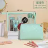Bolsa de maquillaje transparente de PVC estilo ins para viaje portátil impermeable bolso de mano bolsa de aseo bolsa de almacenamiento para cosméticos de cuidado de la piel