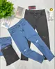 En Stock Modernos y a la Moda Pantalones de Mezclilla con Piernas Rectas Rasgadas para un Look Freestyle - WL113