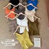 Camisole de cor sólida com decote U, best-seller de outono e inverno, com bojos embutidos, um top confortável e amigo da pele com um lindo design nas costas