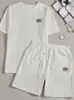 Conjunto de dos piezas de punto casual acanalado de manga corta, diseño de retazos de color liso para hombre, estilo europeo y americano transfronterizo, estilo de ultramar, verano 2026
