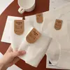 Blanco puro, Grado A, algodón sin blanquear, tiro medio, bragas de triángulo sin costuras, diseño simple y elegante, refuerzo antibacteriano 7A, ropa interior femenina transpirable y amigable con la piel