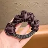 Goma para el pelo de scrunchie con cuentas tridimensionales estilo francés 2026 Nueva Moda Versátil para Cola de Caballo Moño Accesorio para el Cabello