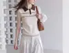 Top de tricô sem mangas com gola polo color block estilo coreano para mulheres, modelo verão 2026, moderno, de caimento solto, com uma ótima estética de design