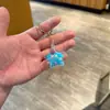 Llavero de Acrílico Transparente Relleno de Aceite con Purpurina, Colgante para Bolso, Pequeño Regalo para Niños, Colgante para Coche