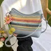 Bolso de axila tejido con paja de arcoíris transfronterizo para mujer, nuevo modelo 2026, bolso de hombro cruzado casual simple de nicho para la playa