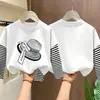 Camiseta de manga larga a rayas de algodón puro para niñas, colección primavera/otoño 2026, estilo nuevo, diseño de caricatura lindo, capa base versátil y a la moda