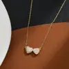 Corrente de clavícula elegante banhada a ouro real com micro cravação de zircônia, design de nicho feminino, colar com pingente de coração, corrente requintada para suéter