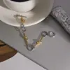 Pulsera Elegante y Silenciosa de Estilo Clásico, Acero Inoxidable 18K Color Bloqueado Hebilla Nudo Ot, Joyería Transfronteriza de Lujo Ligero para Mujer con un Toque de Alta Gama
