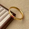 Nuevo Pulsera Espléndida de Esmalte Estilo Corte Dorado Patrón Ruyi Ramas Envueltas Esmalte Hueco Pulsera Antigua Vintage