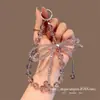 Llavero de Teléfono Corto con Pedrería de Gama Alta, Lazo Doble, Colgante de Botón Único de Moda, Accesorio Hecho a Mano con Cuentas de Cristal