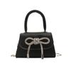 Bolso texturizado de moda de nicho estilo francés para mujer, nuevo modelo Primavera 2026, bolso cuadrado pequeño con lazo, elegante bolso de hombro y cruzado