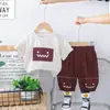 Comércio Exterior Atacado de Roupas Infantis 2025 Novo Verão Lindo Quadrado Rosto Sorridente Manga Curta Conjunto Camiseta Shorts Conjunto