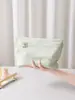 Bolsa cosmética de tela casual con estampado estéreo de trébol de cuatro hojas, gran capacidad, bolsa de almacenamiento para productos de cuidado de la piel, bolsa de neceser de mano para viaje