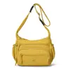 Bolso bandolera mujer simple ligero gran capacidad un hombro 2026 nuevo casual viaje tela de nylon bolso madre mujer