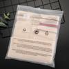 En stock al por mayor palabras de advertencia impresas bolsa de embalaje para ropa traje de baño camiseta ropa bolsa con cremallera esmerilada bolsa de plástico pe transparente