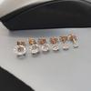 Brincos de pino de quatro garras transfronteiriços europeus e americanos Brincos de pino pequenos personalizados simples com diamantes incrustados para homens e mulheres mini brincos de osso de orelha atacado