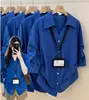 Camisa Azul Elegante com Gola Polo Estilo Francês para Mulheres, Primavera/Verão 2026, Top de Alto Padrão de Luxo com Design que Afina a Cintura