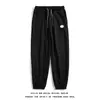 Pantalones waffle al por mayor para hombre, delgados, holgados, casuales, tipo jogger, para primavera y verano, pantalones deportivos grises de moda