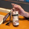 Bolsa de moedas criativa estilo nacional moda balde pequena transparente flor portátil fone de ouvido boca envelope vermelho chave do carro pingente