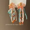 Los Colores de la Primavera Son Súper de Hadas, con Pendientes de Borla con Cuentas Florales en Contraste, una Colección de Pendientes Dopamina a la Moda Estilo Vacaciones