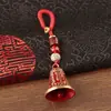 Colgante de campana de cobre roja de diseño original para la fortuna con cuerda tejida a mano y campana con carácter "Fu" para decoración de llavero de coche