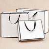 Bolsa de cartón blanca para regalo, bolsa de papel kraft, bolsa de papel para alimentos, ropa, embalaje de joyas, venta al por mayor