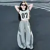 Conjunto de Verão para Meninas 2026 Novo Estilo para Crianças Maiores, Calça Esportiva Solta, Conjunto de Duas Peças com Calça de Perna Larga Curva de Manga Curta Tendência