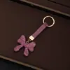 Chaveiro de Carro com Laço Embelezado com Strass de Alta Moda Pingente de Corrente de Celular em Forma de Coração Doce Acessório de Bolsa