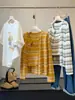 Conjunto de dos piezas para mujer: cárdigan de punto a rayas de manga larga estilo coreano + camisola, nuevo top casual ajustado para primavera y otoño