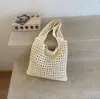 Bolso tejido de gran capacidad para mujer, nuevo estilo coreano de verano 2026, bolso de punto calado, bolsa de playa de malla relajada