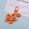 Chaveiro de flor vazada de onda grande colorida pingente de coração miçangas para boneca DIY acessórios de joia atacado