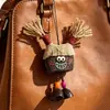 Encantador perrito peludo con la lengua fuera, llavero para bolso, colgante de dibujos animados natural, semillas de terapia de sonido curativas, popular en zonas escénicas, amuleto divertido y adorable