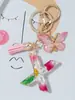 Suministros del Fabricante Llaveros con Flores Secas Prensadas 26 Letras del Alfabeto Inglés Llaveros con Borla de Mariposa Charms para Bolsos de Mujer