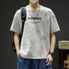 Algodón Nuevo Verano Hombres Moderno Holgado Marca de Moda Estudiante Camiseta de Manga Corta Top con Mangas Tres Cuartos y Cuello Redondo