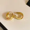 Pendientes de aro redondos metálicos con patrón cruzado, entrelazados, estilo europeo y americano transfronterizo, pendientes de estilo vintage, diseño de nicho, pendientes minimalistas para mujer