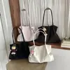 Bolso de mano casual de diseño de nicho estilo coreano, nuevo de moda otoño 2026, bolso de hombro de gran capacidad