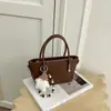 Elegante bolsa de dumplings tejida para mujer, nueva moda otoño 2026, bolso cruzado pequeño versátil para el día a día